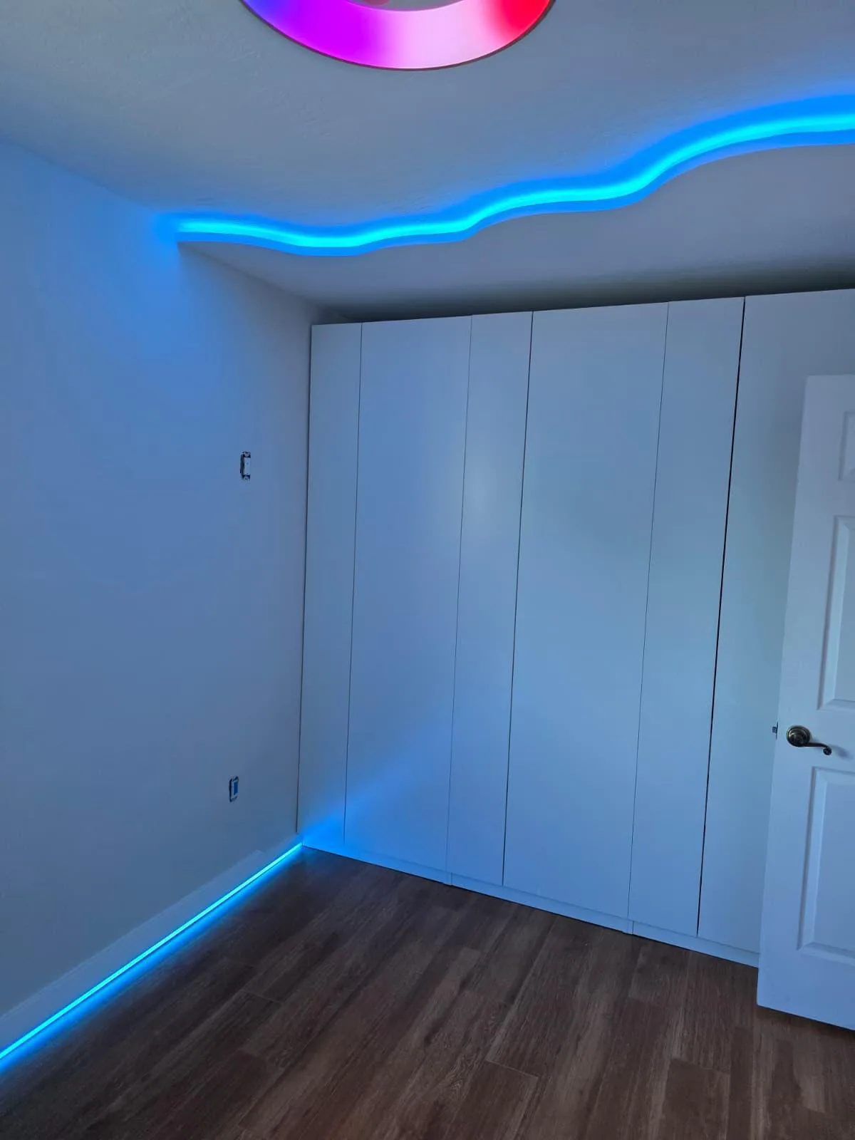Blue LED cove lighting and floor accent strip in a Miami-Dade closet