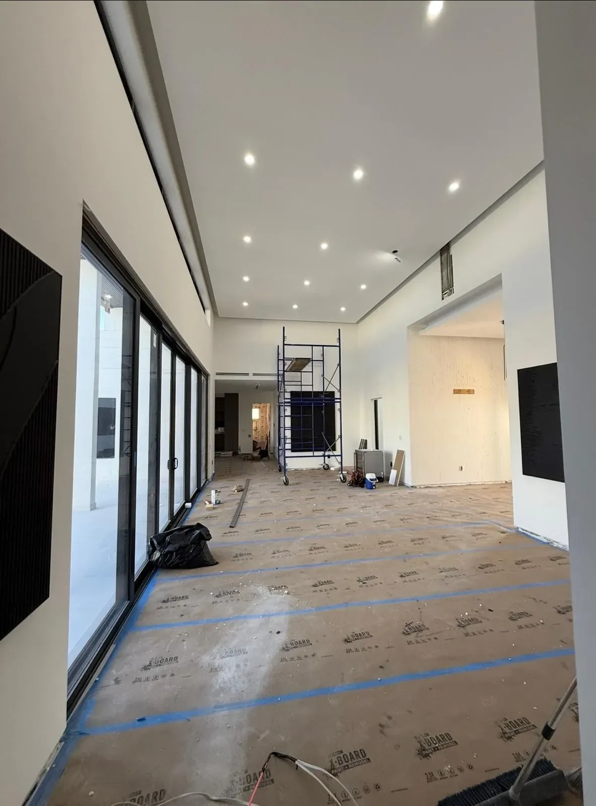 Recessed ceiling lights installed along a hallway in a Miami-Dade luxury home